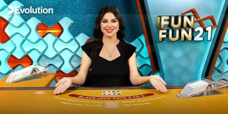 에볼루션 인피니트 펀펀21 블랙잭 게임 테이블 전경, 전문 딜러가 카드를 배분하는 라이브 카지노 현장, 무제한 참여 시스템을 보여주는 고급 게임 환경